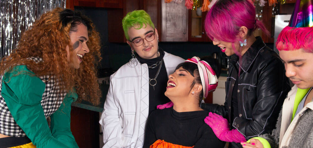 A group of friends of varying genders celebrating