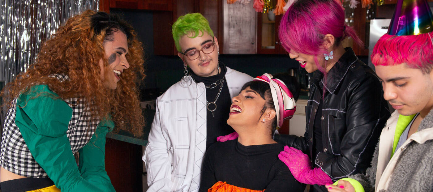 A group of friends of varying genders celebrating